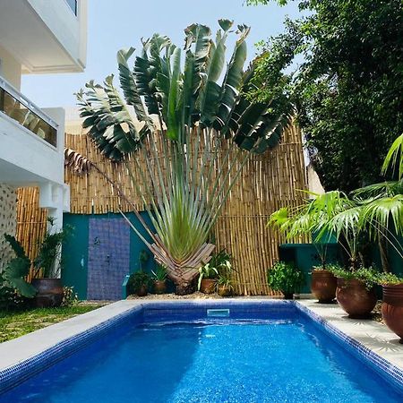 L'Oasis Guesthouse Cotonou Esterno foto