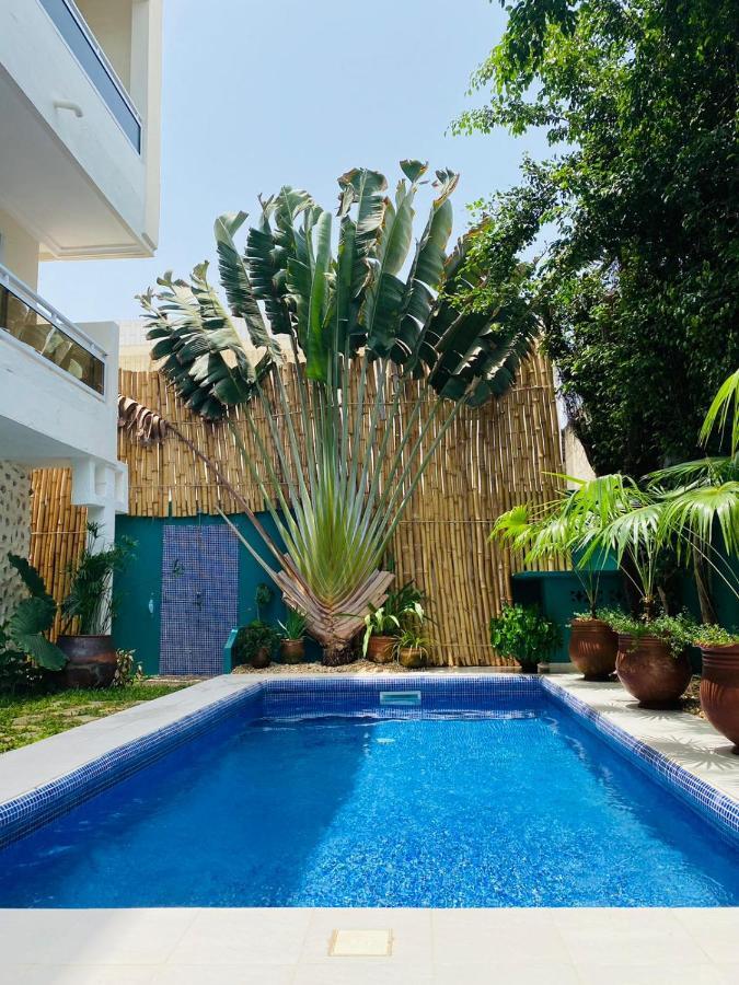 L'Oasis Guesthouse Cotonou Esterno foto