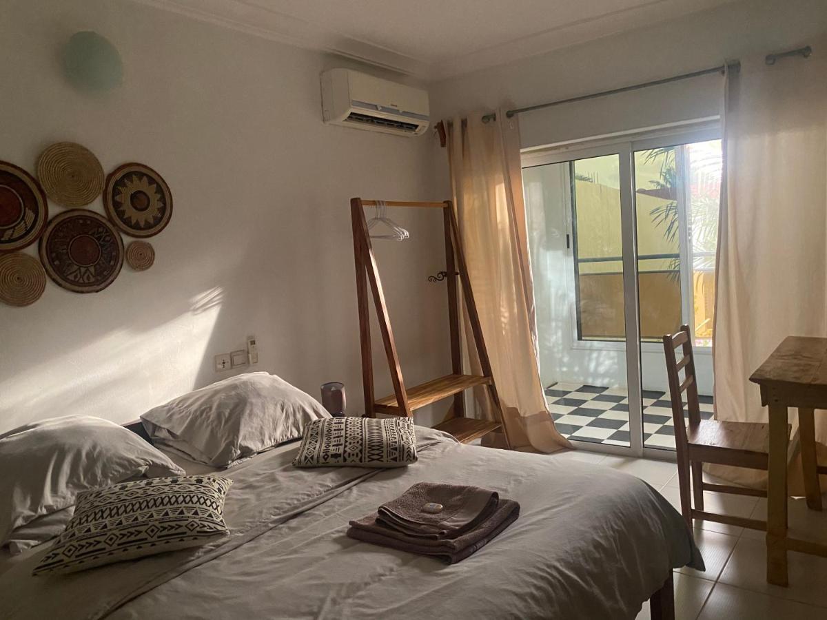 L'Oasis Guesthouse Cotonou Esterno foto