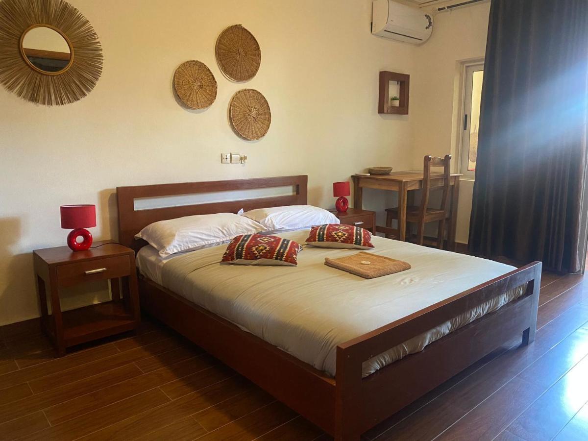 L'Oasis Guesthouse Cotonou Esterno foto