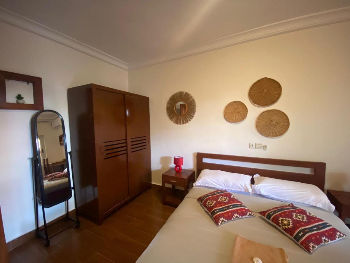 L'Oasis Guesthouse Cotonou Esterno foto