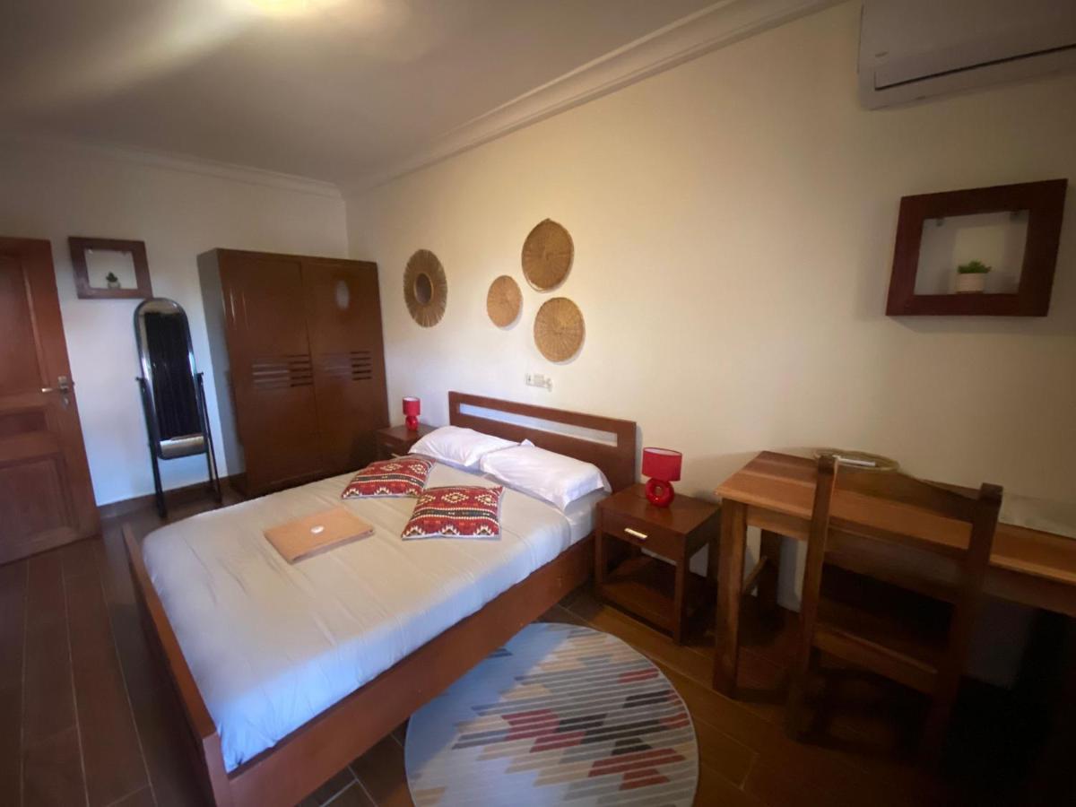 L'Oasis Guesthouse Cotonou Esterno foto