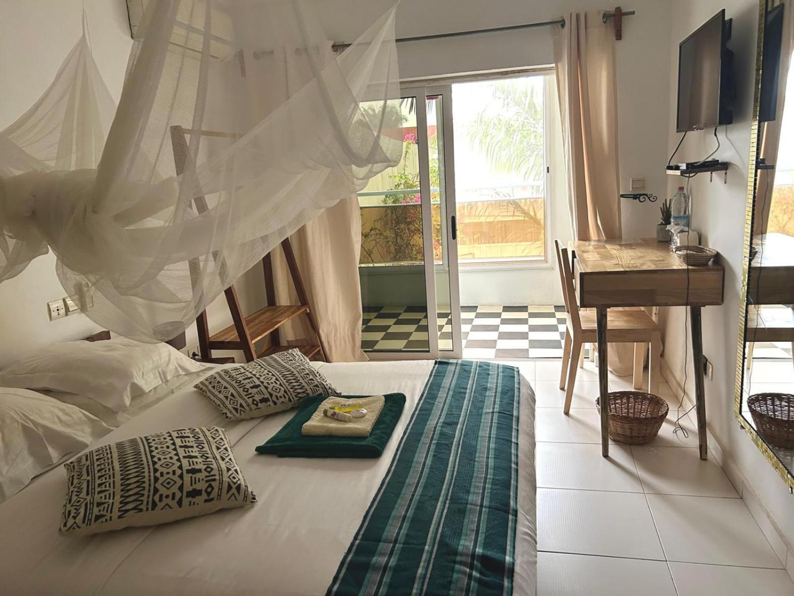 L'Oasis Guesthouse Cotonou Esterno foto