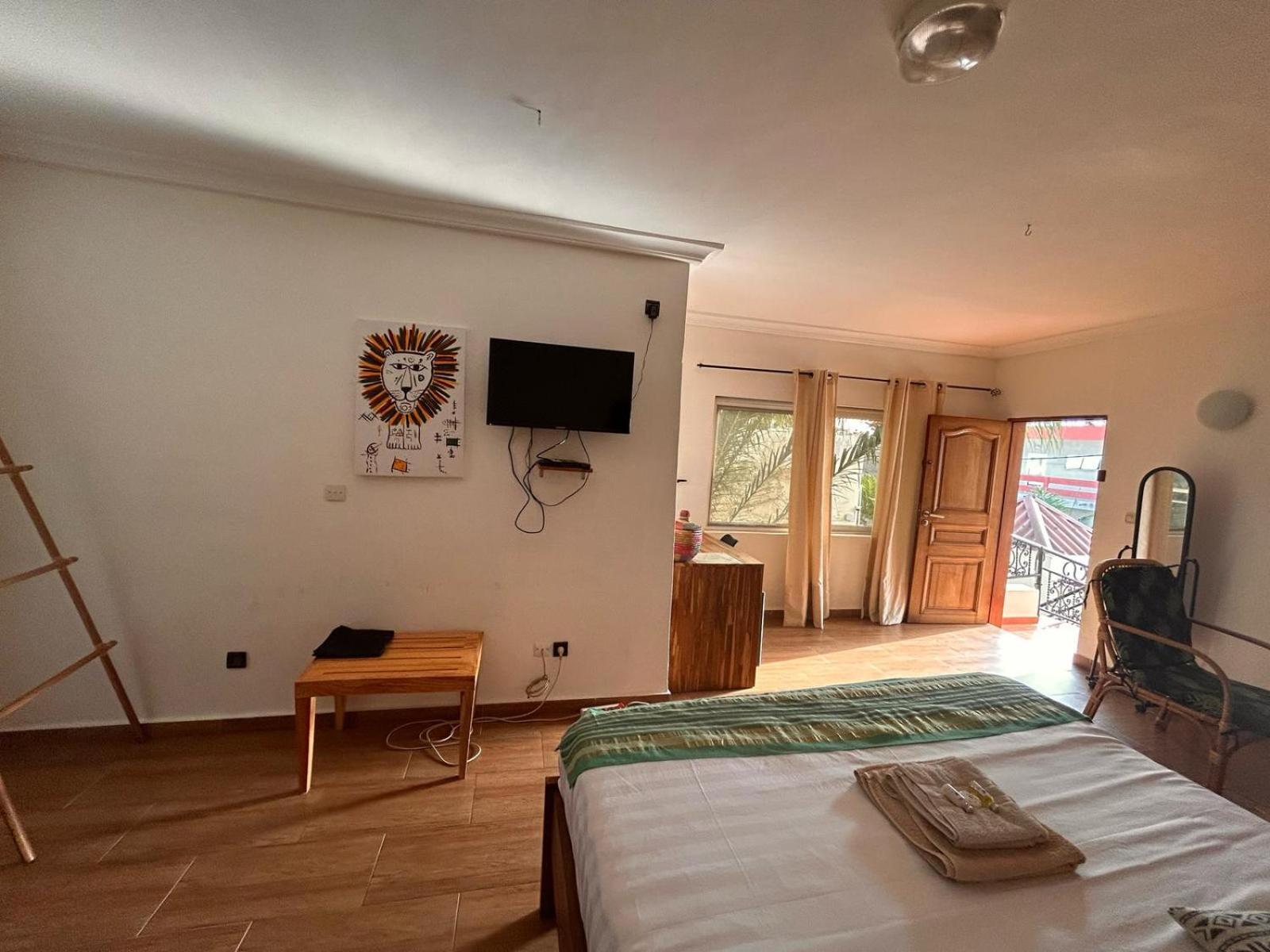 L'Oasis Guesthouse Cotonou Esterno foto